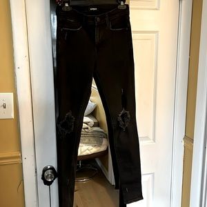 Woman’s skinny ripped jeans